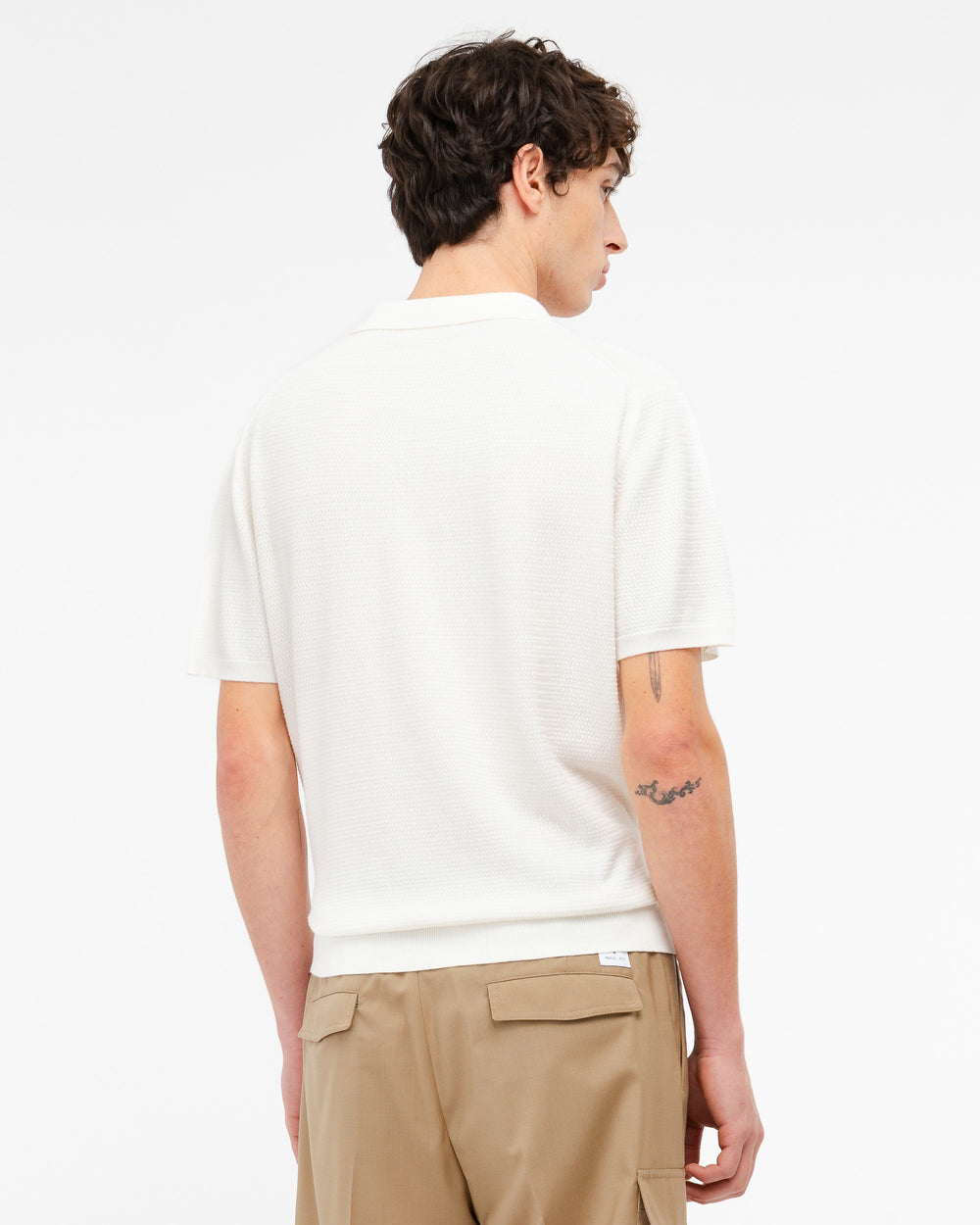 Polo open collar punto spostato in cotone bianco