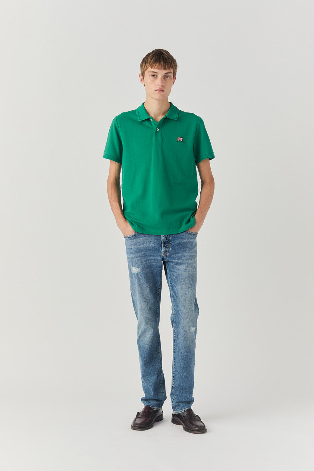 Polo in piquet con logo verde